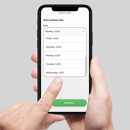 Hand selecting garment pickup date using the Sudsies mobile app